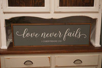 Gray framed love never fails sign. Love never fails wood sign. 1 Corinthians 13:8. Farmhouse love never fails. Love is patient.